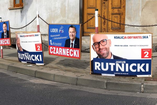 1511654876 PNIEWY, POLAND - SEPTEMBER 21, 2019. Parliamentary election posters of two main contending parties - liberal Civic Coalition (Koalicja Obywatelska) and national- conservative Law and Justice (PiS).